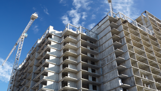 How much do taxes and fees affect new housing costs? 